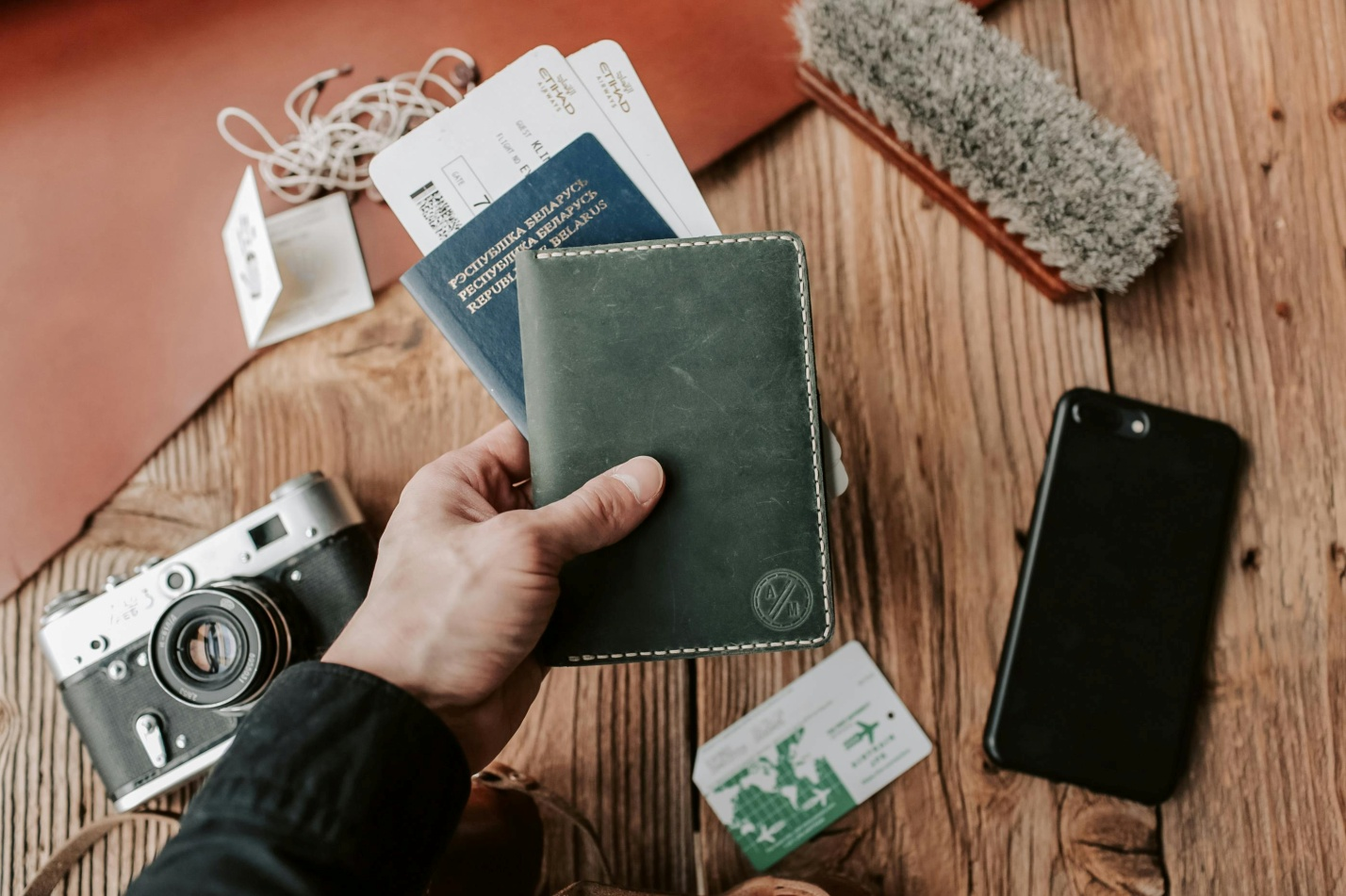 A Leather Passport Holder Among Other Travel Accessories